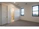 Spacious bedroom with ensuite bathroom and backyard view at 34749 N 83Rd Way, Scottsdale, AZ 85266