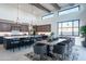 Kitchen dining area with a large table and access to the patio at 34749 N 83Rd Way, Scottsdale, AZ 85266