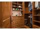 Spacious walk-in closet with custom built-ins and ample shelving at 865 E Monte Vista Trl, Wickenburg, AZ 85390