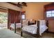 Bedroom with two twin beds and southwestern decor at 865 E Monte Vista Trl, Wickenburg, AZ 85390