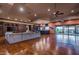 Open great room showcasing a wet bar, hardwood floors and access to the backyard at 865 E Monte Vista Trl, Wickenburg, AZ 85390