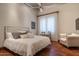 Charming bedroom with hardwood floors and comfy seating at 865 E Monte Vista Trl, Wickenburg, AZ 85390