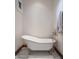 Elegant bathroom featuring a clawfoot tub and marble flooring at 865 E Monte Vista Trl, Wickenburg, AZ 85390