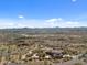 Aerial view of house with mountain views and a long driveway at 865 E Monte Vista Trl, Wickenburg, AZ 85390
