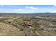 Aerial view showcasing a house on a large lot with desert landscape at 865 E Monte Vista Trl, Wickenburg, AZ 85390