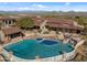 Luxury estate with expansive pool, mountain views, and multiple outdoor entertaining areas at 865 E Monte Vista Trl, Wickenburg, AZ 85390