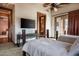 Bedroom with two twin beds and access to outdoor space at 865 E Monte Vista Trl, Wickenburg, AZ 85390