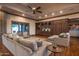 Spacious living room with large sectional sofa and hardwood floors at 865 E Monte Vista Trl, Wickenburg, AZ 85390