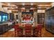 Large kitchen island with red barstools and exposed wooden beams at 865 E Monte Vista Trl, Wickenburg, AZ 85390