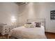 Bright bedroom with a comfortable bed and hardwood floors at 865 E Monte Vista Trl, Wickenburg, AZ 85390