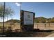 Welcoming entrance sign to Brighthaven Estates 55+ community at 8421 E Main St # 106, Mesa, AZ 85207