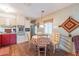 Eat-in kitchen with table and chairs, and red cabinets at 8421 E Main St # 106, Mesa, AZ 85207
