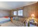 Bright bedroom with a comfortable bed and a sofa at 8421 E Main St # 106, Mesa, AZ 85207