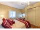 Main bedroom with a double bed and wood closet doors at 8421 E Main St # 106, Mesa, AZ 85207