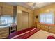 Bedroom with a double bed, dresser, and built-in closet at 8421 E Main St # 106, Mesa, AZ 85207