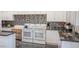 Modern kitchen with double ovens and granite countertops at 8421 E Main St # 106, Mesa, AZ 85207