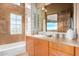 Bathroom with a soaking tub, walk-in shower, and modern vanity at 11108 E Mariola Way, Scottsdale, AZ 85262