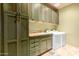 Functional laundry room with washer, dryer, and extra storage at 11108 E Mariola Way, Scottsdale, AZ 85262
