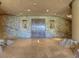 Grand entry with stone walls, double doors and tile floors at 11108 E Mariola Way, Scottsdale, AZ 85262