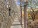 Stone walkway with a pergola and desert landscaping at 11108 E Mariola Way, Scottsdale, AZ 85262