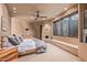 Bright bedroom with a king-size bed and built-in fireplace at 11108 E Mariola Way, Scottsdale, AZ 85262