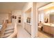 Upstairs hallway with built-in storage and half bathroom at 1873 E Mcnair Dr, Tempe, AZ 85283