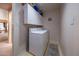 Convenient laundry room with upper cabinets at 1873 E Mcnair Dr, Tempe, AZ 85283