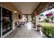 Relaxing covered patio with seating and access to the backyard at 1873 E Mcnair Dr, Tempe, AZ 85283