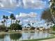 Serene community lake view with palm trees and homes at 1873 E Mcnair Dr, Tempe, AZ 85283