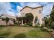 Charming backyard with grassy area and covered patio at 1873 E Mcnair Dr, Tempe, AZ 85283