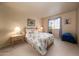 Cozy bedroom with floral bedding and bedside tables at 1873 E Mcnair Dr, Tempe, AZ 85283