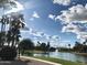 Peaceful community lake with fountain and palm trees at 1873 E Mcnair Dr, Tempe, AZ 85283