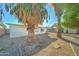 Landscaped backyard with palm trees and gravel at 4522 N 14Th Ave, Phoenix, AZ 85013