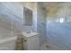 Updated bathroom with marble tile and a walk-in shower at 4522 N 14Th Ave, Phoenix, AZ 85013