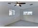 Bright bedroom with two windows, ceiling fan, and wood-look floors at 4522 N 14Th Ave, Phoenix, AZ 85013