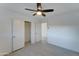 Spacious bedroom with ceiling fan, closet, and access to other rooms at 4522 N 14Th Ave, Phoenix, AZ 85013
