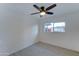 Well-lit bedroom featuring a ceiling fan and a window offering a street view at 4522 N 14Th Ave, Phoenix, AZ 85013