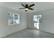 Bedroom with ceiling fan and two windows providing natural light at 4522 N 14Th Ave, Phoenix, AZ 85013