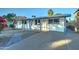 Updated single story home with gray driveway and landscaping at 4522 N 14Th Ave, Phoenix, AZ 85013
