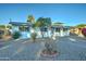 White single story home with a gravel front yard and mature landscaping at 4522 N 14Th Ave, Phoenix, AZ 85013