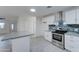 Modern kitchen with white cabinets, granite countertops and stainless steel appliances at 4522 N 14Th Ave, Phoenix, AZ 85013