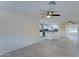 Open concept living room with kitchen view, wood-look floors and ceiling fan at 4522 N 14Th Ave, Phoenix, AZ 85013