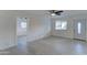 Spacious living area with light floors, fresh paint, and ceiling fan at 4522 N 14Th Ave, Phoenix, AZ 85013