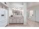 Kitchen features a breakfast bar and white cabinets at 1351 N Pleasant Dr # 1098, Chandler, AZ 85225