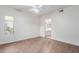 Bright bedroom with wood-look floors and ceiling fan at 1351 N Pleasant Dr # 1098, Chandler, AZ 85225