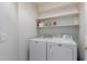 Laundry room with washer, dryer and shelving at 1351 N Pleasant Dr # 1098, Chandler, AZ 85225
