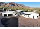 Modern house with a two-car garage, nestled in a scenic desert landscape with mountain views at 3525 S Kings Ranch Ct # 4, Gold Canyon, AZ 85118