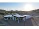 Aerial view of a sleek, modern house with a flat roof and expansive backyard at 3525 S Kings Ranch Ct # 4, Gold Canyon, AZ 85118