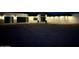 Modern house exterior at night, illuminated with stylish lighting features at 3525 S Kings Ranch Ct # 4, Gold Canyon, AZ 85118
