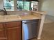 Kitchen with dishwasher and double sink at 17626 W Calistoga Dr, Surprise, AZ 85387